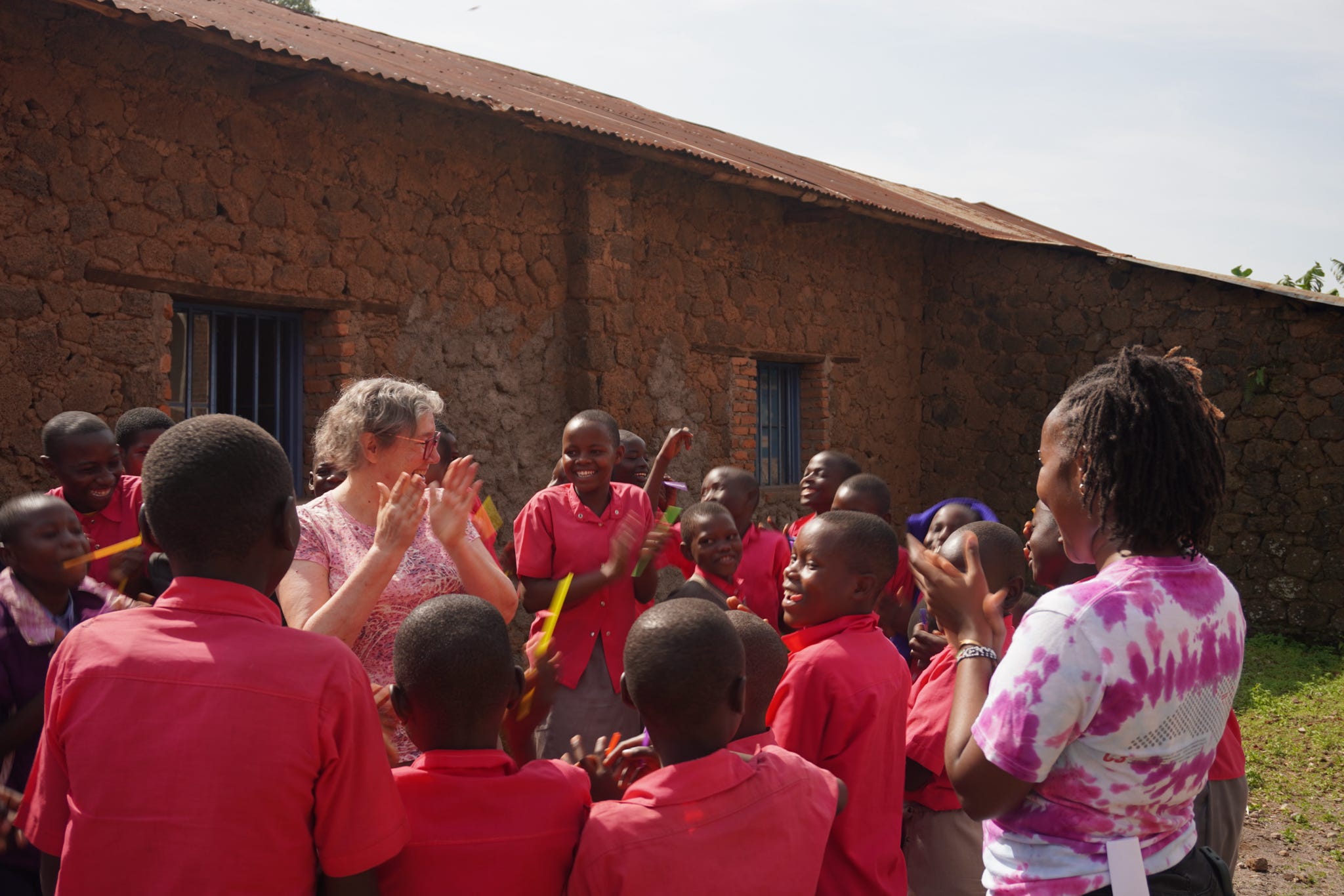 ASB Rwanda participants with local school children.