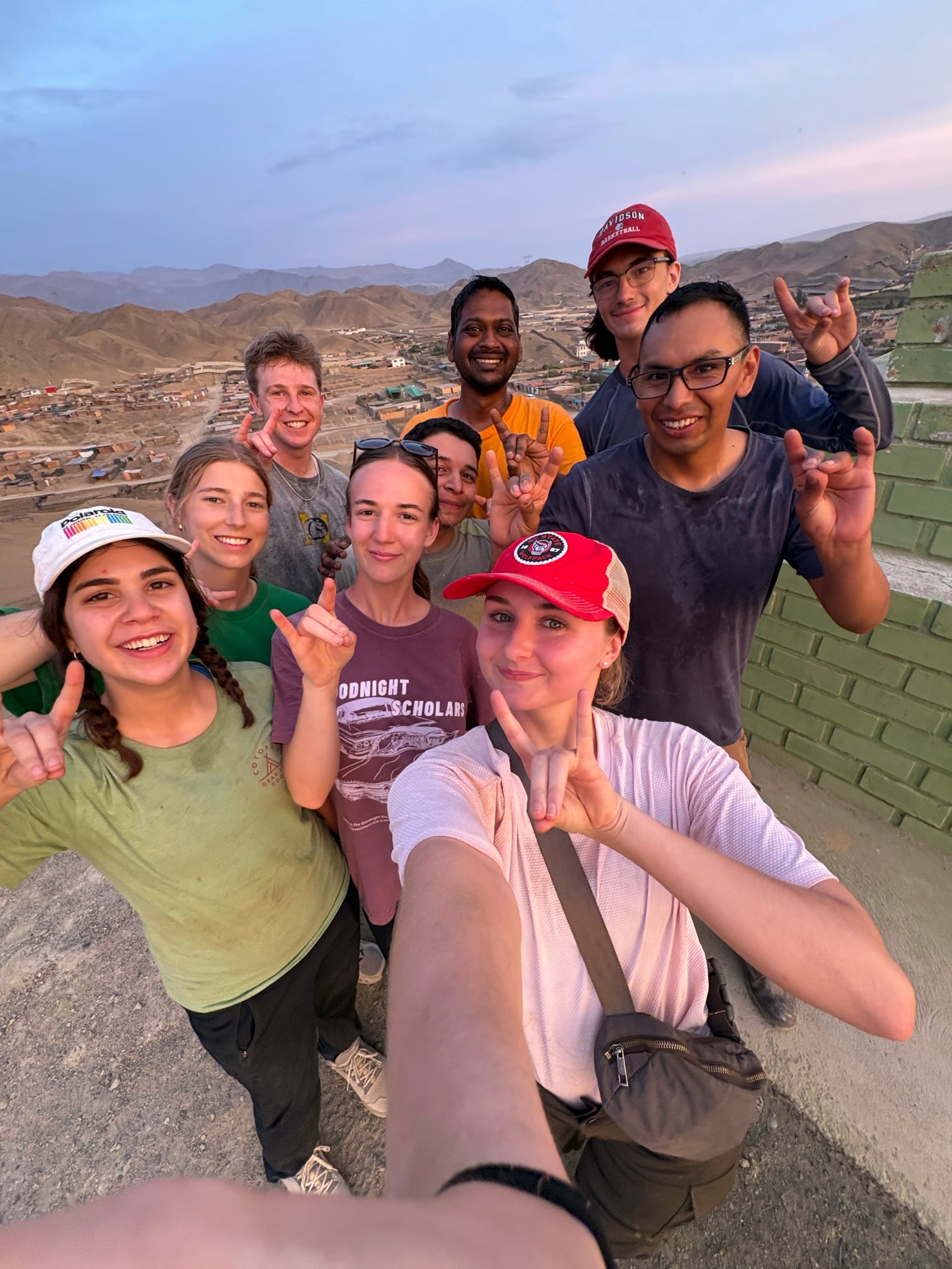 ASB Peru participants pose for a photo while on a evening walk with our community partner.